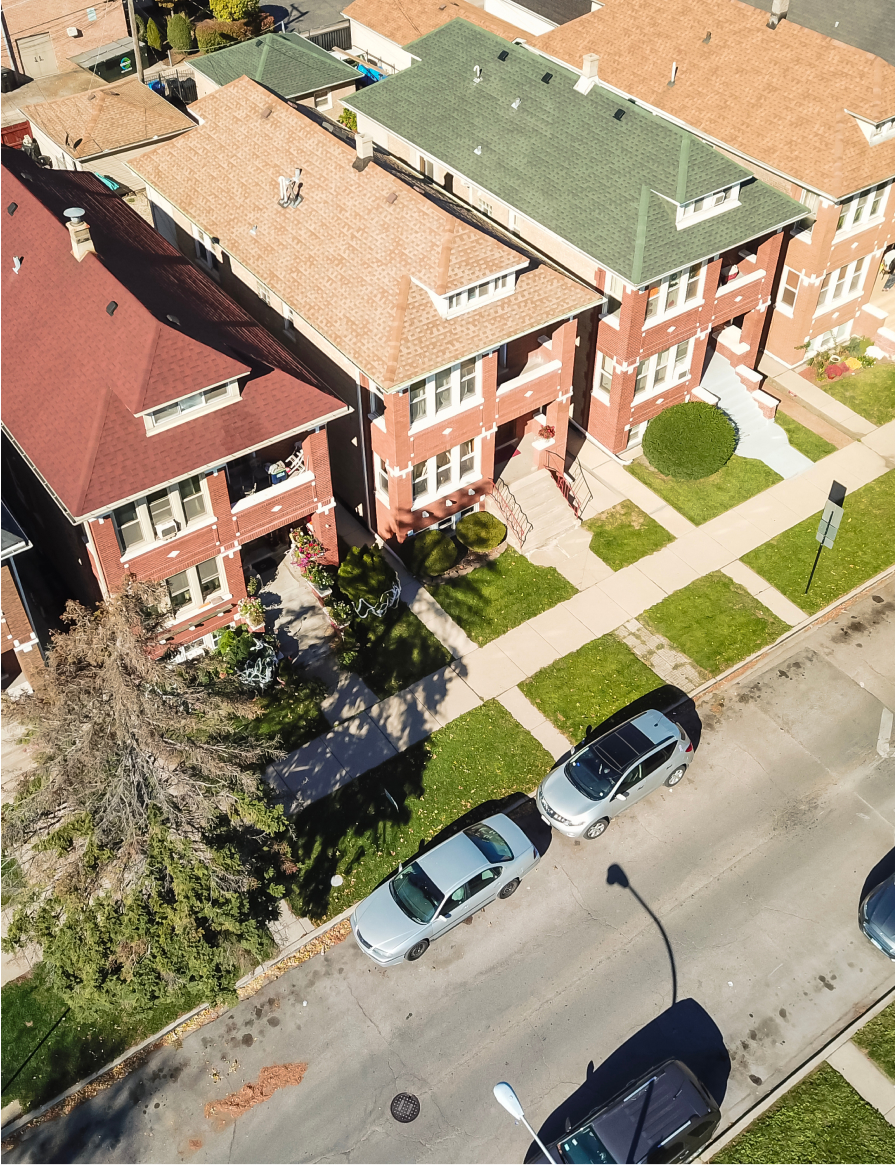 Aerial view classical townhouses in Chicago with garden and detached garage
